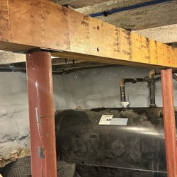 New England Structural Works - Supplemental support with new posts - notched the beam to work around the oil pipe.