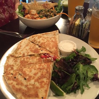 Kayak Kafe - Vegetarian salad in the background. Chicken and goat cheese quesadilla with mixed greens. - Mexican Near Me - Savannah, Georgia