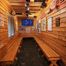 Texas Roadhouse - A hall with a display of all the community work Texas Roadhouse is doing for the community and waiting area for when restaurant is full.
