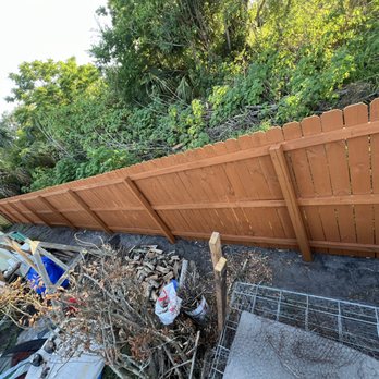 Sousa Lawn Care - Staining a 300 foot-long fence on each side with a 5 inch brush - Lawn Services Near Me Sousa Lawn Care - Staining a 300 foot-long fence on each side with a 5 inch brush - Lawn Services Near Me