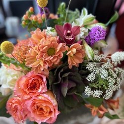 Ivy & Olive's - Gorgeous floral arrangement in a square green planter.