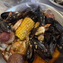 Crab’s Landing - Black mussels, shrimp and plenty of garlic/butter with more on the side. Also had the steamed oysters. So delicious, all of it.