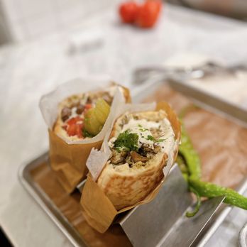 Miznon - Rotisserie chicken pita with tahini, za'atar, spicy green peppers, scallions - Mediterranean Near Me - Las Vegas, Nevada Miznon - Rotisserie chicken pita with tahini, za'atar, spicy green peppers, scallions - Mediterranean Near Me - Las Vegas, Nevada