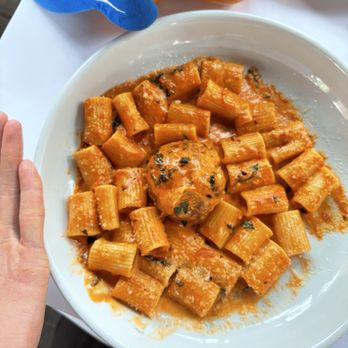 Ascione Bistro - Rigatoni pasta with a meatball in the center. Generous portion size - Italian Near Me - Chicago, Illinois Ascione Bistro - Rigatoni pasta with a meatball in the center. Generous portion size - Italian Near Me - Chicago, Illinois
