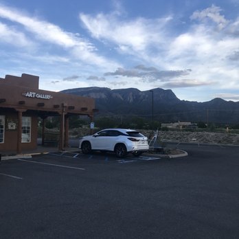 The Merc - a white car parked in a parking lot - Grocery Near Me - Placitas, New Mexico