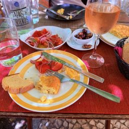 Table with Tortilla, bread olives and salad Algarve Table with Tortilla, bread olives and salad Algarve
