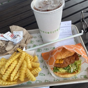 Shake Shack Bay Plaza - Hot honey chicken fries and a half and half Ice tea and lemonade So good - Burgers Near Me - Bronx, New York Shake Shack Bay Plaza - Hot honey chicken fries and a half and half Ice tea and lemonade So good - Burgers Near Me - Bronx, New York