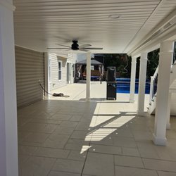 Before & After Home Improvement - Waterproof area below the deck with gutters - recessed lights and fan - white ceiling - pvc trims
