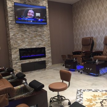 Lux Nails - Pedicure room, clean, nice curve tv and fireplace. Cozy, relaxing and inviting! - Nail Salons Near Me - Northborough, Massachusetts