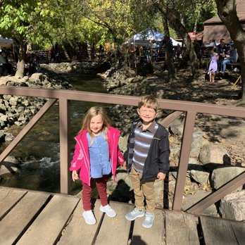 Franklin Cider Mill - Grandkids on one of cerebral bridges gloving over the Cider Mill Creek - Donuts Near Me - Bloomfield Hills, Michigan Franklin Cider Mill - Grandkids on one of cerebral bridges gloving over the Cider Mill Creek - Donuts Near Me - Bloomfield Hills, Michigan
