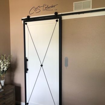 C&S Toolworks - A modern touch on a beautiful bathroom slider - metal frame surrounding a custom wood door, with machined metal accents and wire rope. - Carpenters Near Me - Parker, Colorado C&S Toolworks - A modern touch on a beautiful bathroom slider - metal frame surrounding a custom wood door, with machined metal accents and wire rope. - Carpenters Near Me - Parker, Colorado