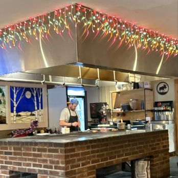 Foggy's Steakhouse - Grilling area and Chef are in the open. Which was cool. - Sports Bars Near Me - Christmas, Michigan Foggy's Steakhouse - Grilling area and Chef are in the open. Which was cool. - Sports Bars Near Me - Christmas, Michigan