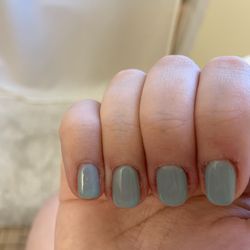 Keeley's Beauty Salon - Pinky finger has a small hair cured by the UV light stuck in the polish.