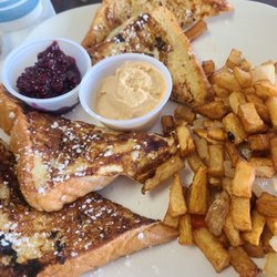 Happy Day Café - French toast with peanut butter cream &raspberry jam. BEST breakfast potatoes