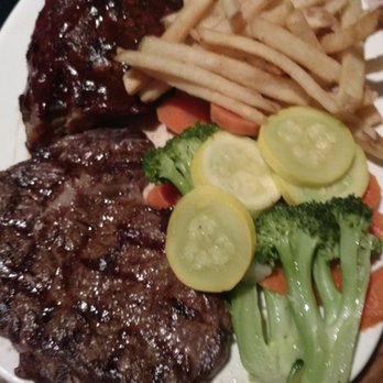 Outback Steakhouse - Steak and ribs, side of fries and mixed veggies. This is not on the menu, but our waiter made it happen. - Steakhouses Near Me - California, Maryland Outback Steakhouse - Steak and ribs, side of fries and mixed veggies. This is not on the menu, but our waiter made it happen. - Steakhouses Near Me - California, Maryland