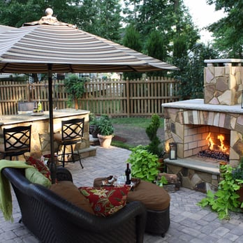 Ultimate Hardscapes - a patio with an outdoor fireplace - General Contractors Near Me - Newport News, Virginia Ultimate Hardscapes - a patio with an outdoor fireplace - General Contractors Near Me - Newport News, Virginia