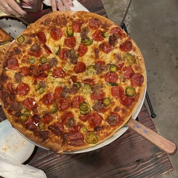 Muze Gastropub - Excellent pizza with pepperoni, sausage jalapeños and hot honey. - Gastropubs Near Me - Lakewood, Ohio