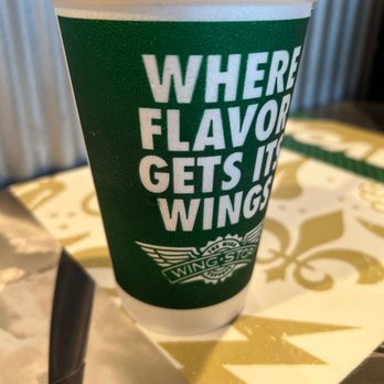 Wingstop - a cup of coffee on a table - Chicken Wings Near Me - Westminster, California