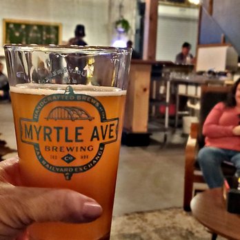 Myrtle Avenue Brewing - a hand holding a pint of beer - Breweries Near Me - Jacksonville, Florida Myrtle Avenue Brewing - a hand holding a pint of beer - Breweries Near Me - Jacksonville, Florida