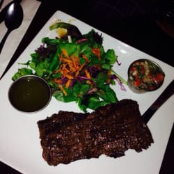 Mojito Cafe & Lounge - Delicious churrasco with chimichurri sauce, came with a side of white rice and black beans. I also had a side of sweet plantains