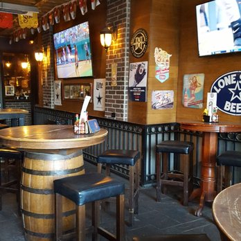 Scruffy Duffies - Patio has two sports T.V.s on this side. - Pubs Near Me - Plano, Texas