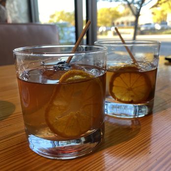 District Pour House - two glasses of iced tea on a table - Bars Near Me - Shawnee, Kansas District Pour House - two glasses of iced tea on a table - Bars Near Me - Shawnee, Kansas