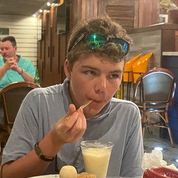 Sundowners - A very happy young man! - Seafood Near Me - Key Largo, Florida Sundowners - A very happy young man! - Seafood Near Me - Key Largo, Florida