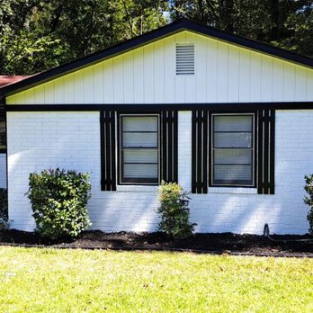 Genesis Renovations Services - a white house with black shutters - General Contractors Near Me Genesis Renovations Services - a white house with black shutters - General Contractors Near Me