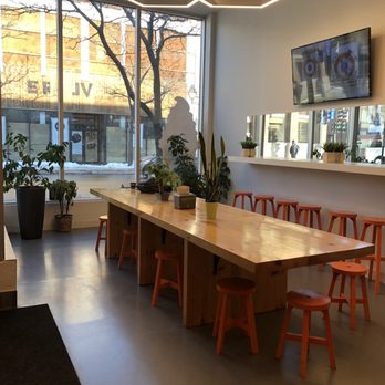 Mr. Puffs - a long table with orange chairs - Desserts Near Me - Montreal, Quebec Mr. Puffs - a long table with orange chairs - Desserts Near Me - Montreal, Quebec