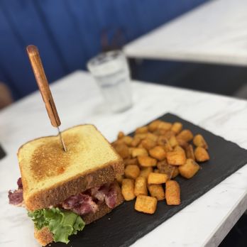 Brunch & Bloom - BBLT beef, bacon, lettuce, and tomato sandwich with fried potatoes - Breakfast & Brunch Near Me - Humble, Texas Brunch & Bloom - BBLT beef, bacon, lettuce, and tomato sandwich with fried potatoes - Breakfast & Brunch Near Me - Humble, Texas
