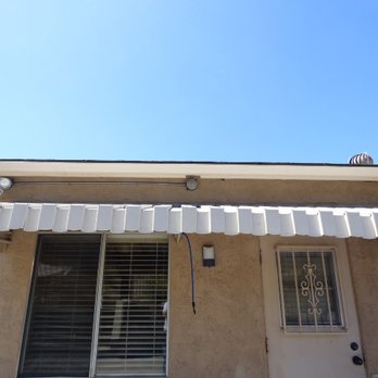 Harbor Pest Control - Nest located above window awning under roof eaves - Pest Control Near Me - San Diego, California Harbor Pest Control - Nest located above window awning under roof eaves - Pest Control Near Me - San Diego, California