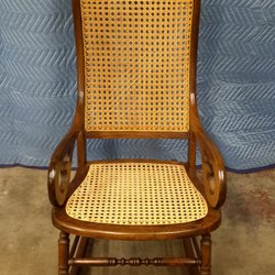 Furniture Fixitor - Lincoln Rocker with new woven cane seat and missing front spindle replaced.
