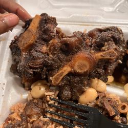 Daisy's Authentic Jamaican Restaurant - Oxtails had little to no meat with no gravy . I was told I had to ask for "extra gravy" yet there was none to start with