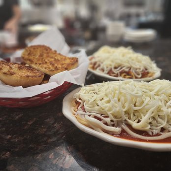 Vince's Spaghetti - two plates of spaghetti and bread - Italian Near Me - Rancho Cucamonga, California Vince's Spaghetti - two plates of spaghetti and bread - Italian Near Me - Rancho Cucamonga, California