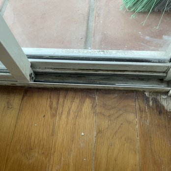 Flooring & Refinishing Guru - Before: all sliding doors had this type of water damage at the corners - Flooring Near Me Flooring & Refinishing Guru - Before: all sliding doors had this type of water damage at the corners - Flooring Near Me