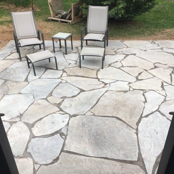 Frazier Landscapers - a patio with chairs and a fire pit - Lawn Services Near Me - Horsham, Pennsylvania Frazier Landscapers - a patio with chairs and a fire pit - Lawn Services Near Me - Horsham, Pennsylvania
