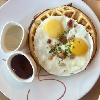 GIADA - Polenta waffle with two sunny side up eggs and pancetta. The syrup was tastier with it than the bechamel. - Italian Near Me - Las Vegas, Nevada