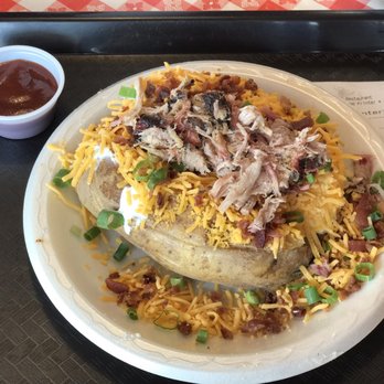 Hog Wild Pit Bar-B-Q - Loaded potato with pulled pork. $7.34 with tax. I'm satisfied! - Fast Food Near Me - Omaha, Nebraska Hog Wild Pit Bar-B-Q - Loaded potato with pulled pork. $7.34 with tax. I'm satisfied! - Fast Food Near Me - Omaha, Nebraska