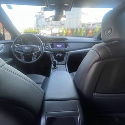 Elite Luxury Transports - Clean, well-maintained Cadillac XT5 cabin prepared for dependable private airport transportation.