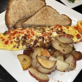 Keke's Breakfast Cafe - Bacon, Tomato, and cheddar cheese omelet with wheat toast and home fries - Breakfast & Brunch Near Me - Brandon, Florida