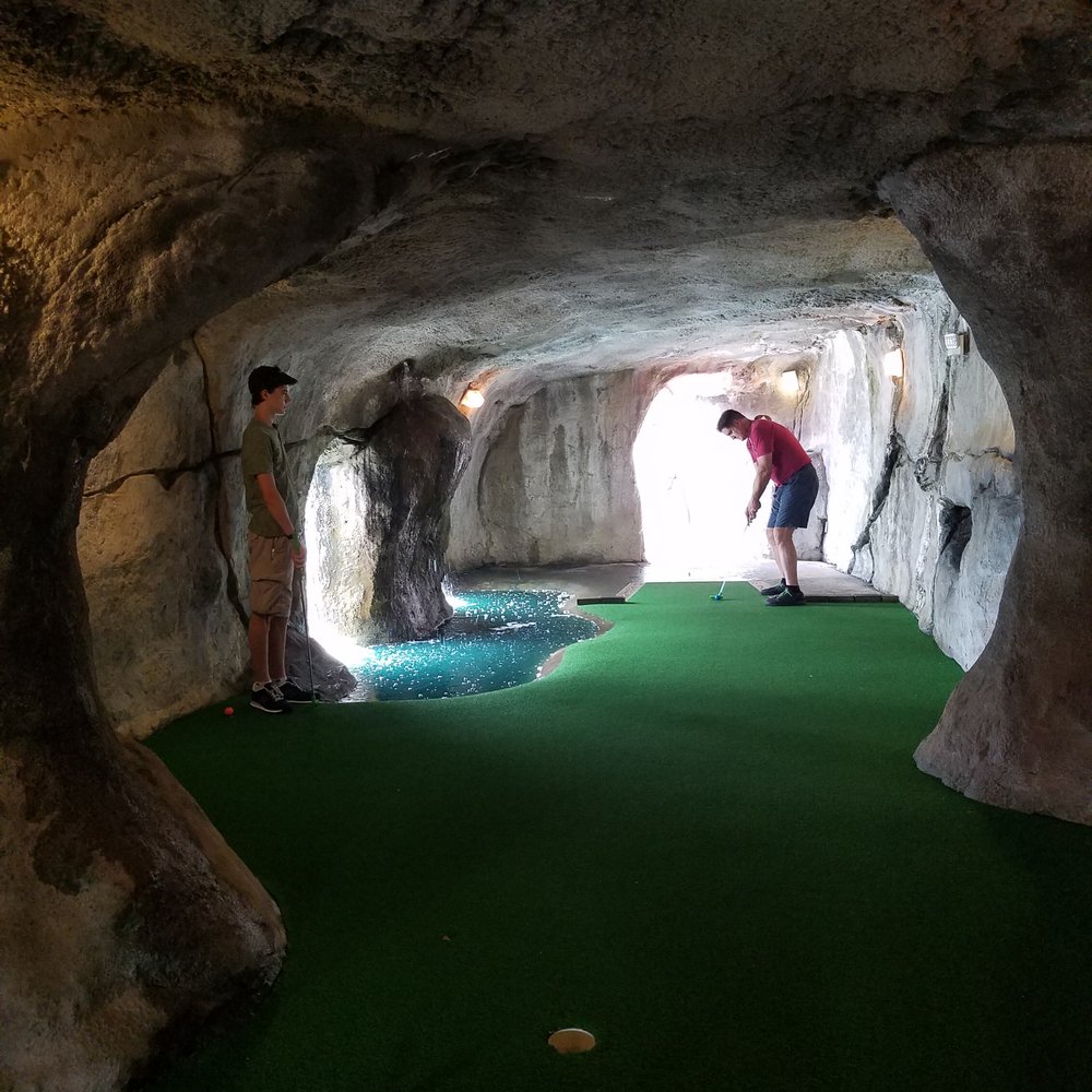 Capt Hook's Adventure Golf - Playing one of the cave holes. - Mini Golf Near Me - Myrtle Beach, South Carolina Capt Hook's Adventure Golf - Playing one of the cave holes. - Mini Golf Near Me - Myrtle Beach, South Carolina