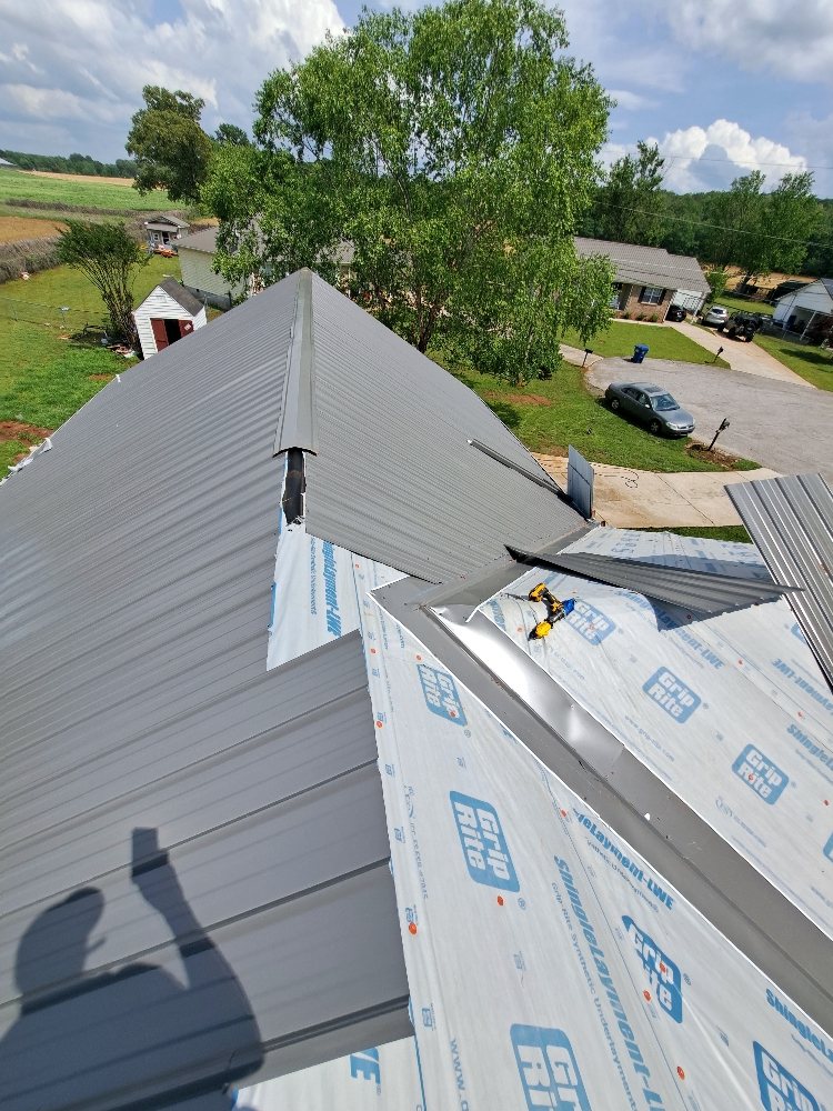Slide of Mike's roofing and repairs