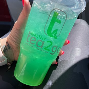 Tea2Go TeaN’ergy San Angelo - a hand holding a cup of tea - Tea Rooms Near Me - San Angelo, Texas