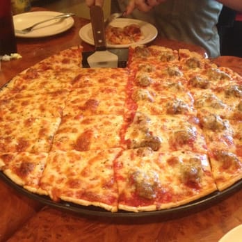 Pusateri's Chicago Pizza - Chicago style thin crust.. Cut in square like how it's suppose to be. Love it. - Pizza Near Me - Stuart, Florida Pusateri's Chicago Pizza - Chicago style thin crust.. Cut in square like how it's suppose to be. Love it. - Pizza Near Me - Stuart, Florida