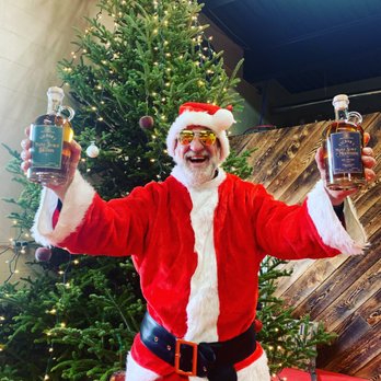 New Heritage Distilling - santa holding a bottle of whiskey - Distilleries Near Me - Davis, West Virginia