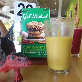 Laughing Planet - A couple of the fruit smoothies, and the rad dinosaur figurine we had at our table. - Vegetarian Near Me - Reno, Nevada Laughing Planet - A couple of the fruit smoothies, and the rad dinosaur figurine we had at our table. - Vegetarian Near Me - Reno, Nevada