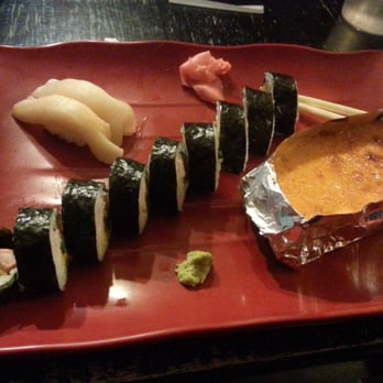 iZen's Drunken Bento - Left to right: white tuna nigiri, futomaki roll, and a volcano roll (in the foil) - Sushi Bars Near Me - Cincinnati, Ohio