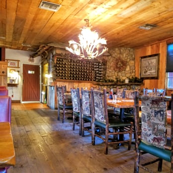 Janet's Montana Cafe - Large table in the middle of dining room - American Near Me - Alpine, California Janet's Montana Cafe - Large table in the middle of dining room - American Near Me - Alpine, California
