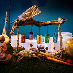 Rooted Vibrations - Sound healing setup with crystal bowls, flutes, gong, and Zaphir chimes, each adding unique frequencies to the experience.