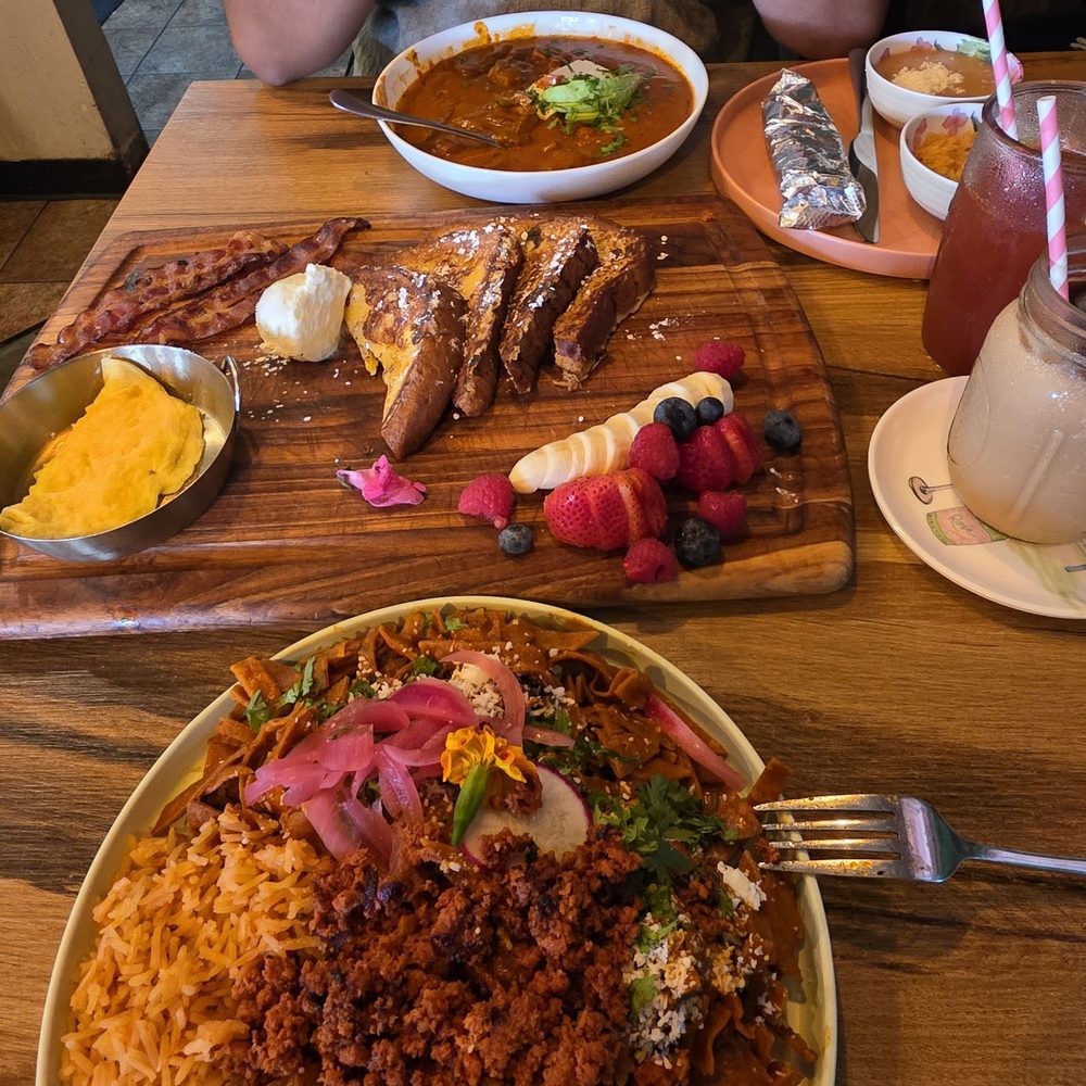 El Encanto - We got the chilaquiles rojos and I added chorizo and eggs & the bistec ranchero plate as well - Breakfast & Brunch Near Me - San Diego, California